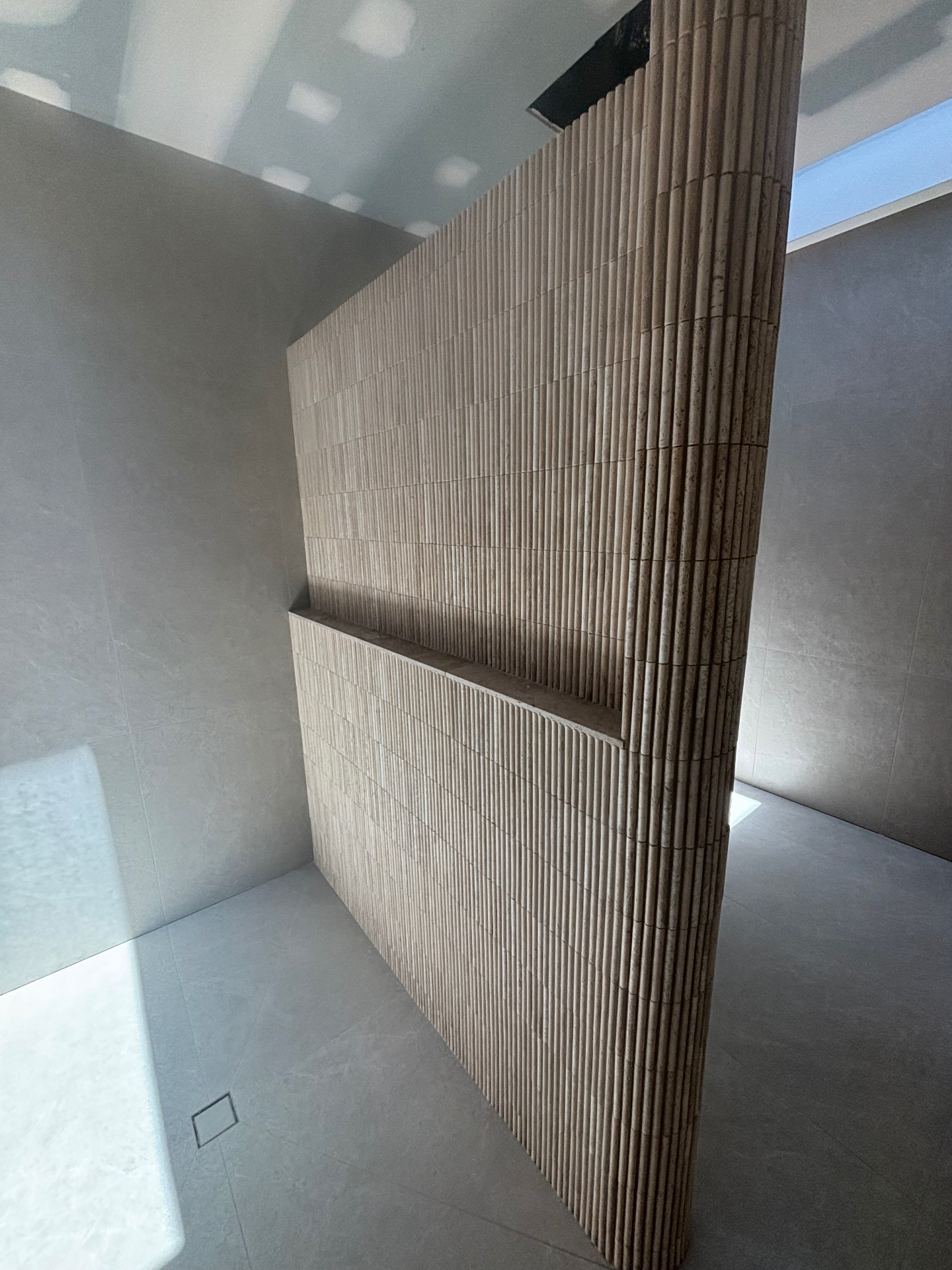 Luxury fluted travertine tiling on the Sunshine Coast