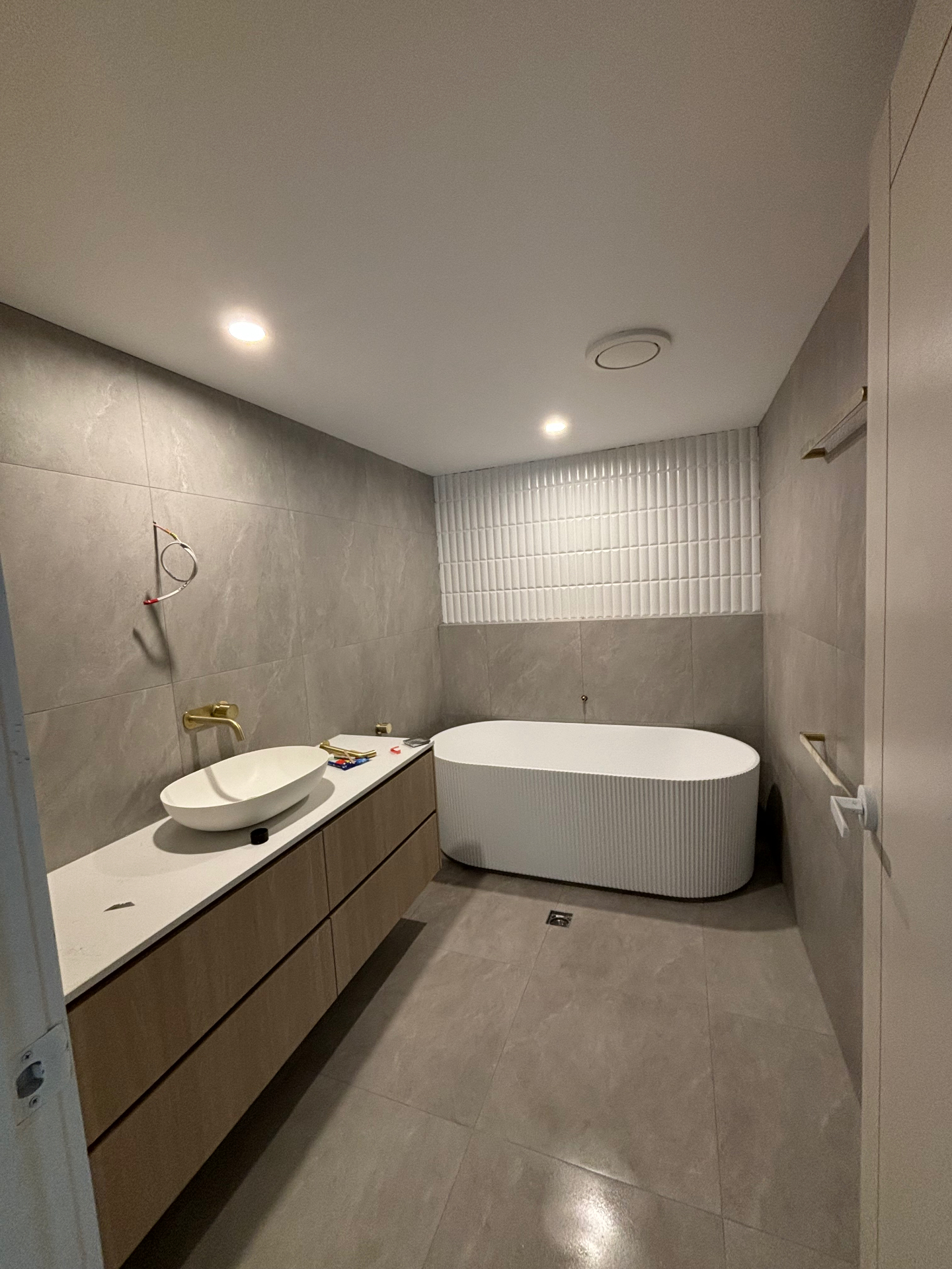 Bespoke Sunshine Coast bathroom with fluted freestanding bath